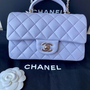 Chanel Mini Flap with top handle.